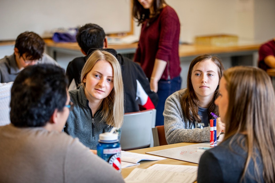 Students studying in conference room