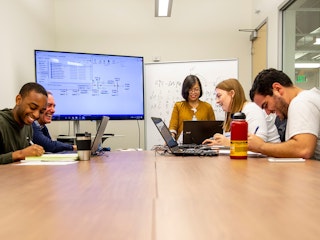 Students studying in conference room