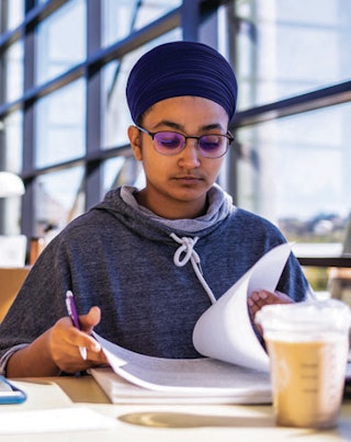UW Student studying in a library